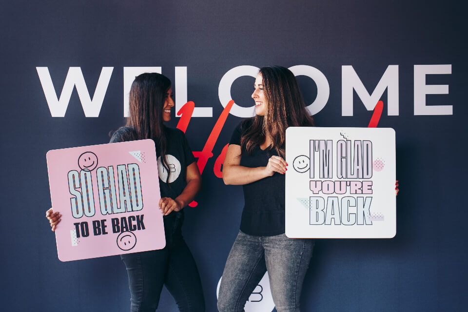 girls holding signs